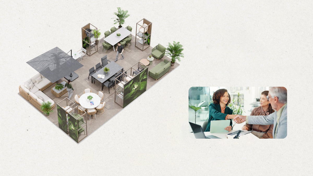 Modern office furniture layout with people collaborating on a laptop.