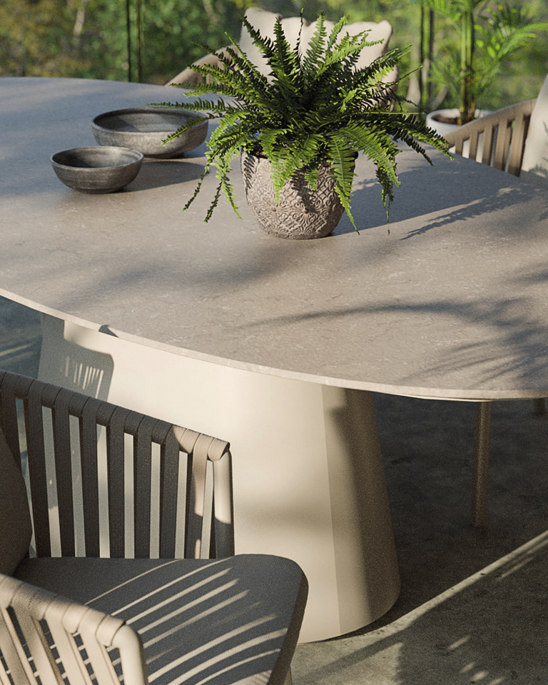 Oval shaped outdoor dining table with 6 chairs on a patio from Royal Garden