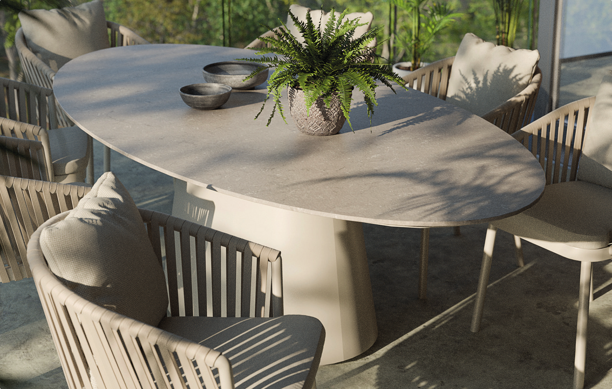 Oval shaped outdoor dining table with 6 chairs on a patio from Royal Garden