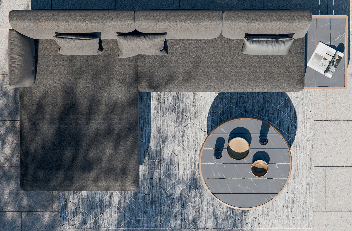 Top-down view of a modern, L-shaped outdoor sofa set with a round coffee table. 