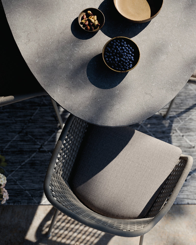 Outdoor furniture set with wicker chairs and a table with a marble finish  from Royal Garden. 